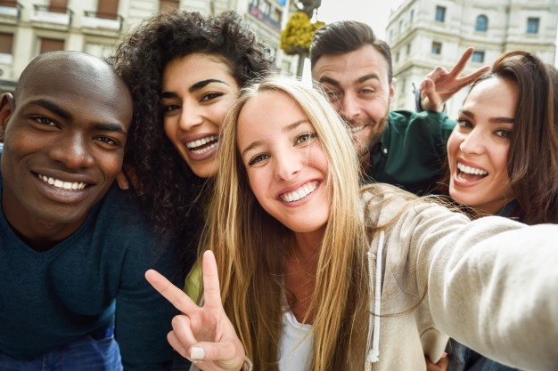 Group of young people, peace sign