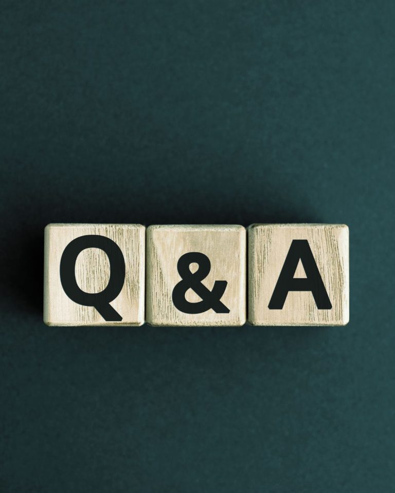 Wooden blocks displaying the letters Q & A, representing a questions and answers section.